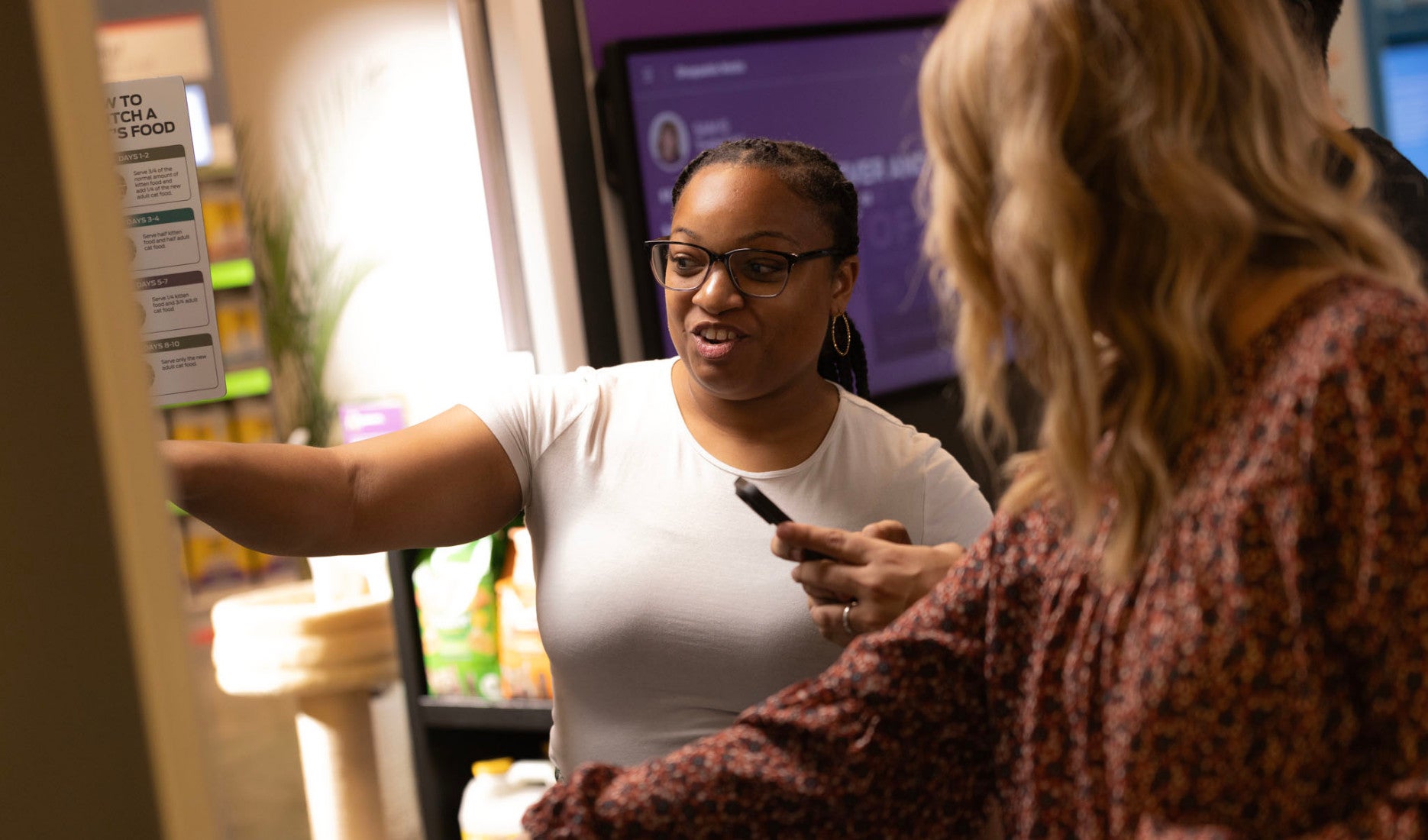 Purina associates looking at pet food