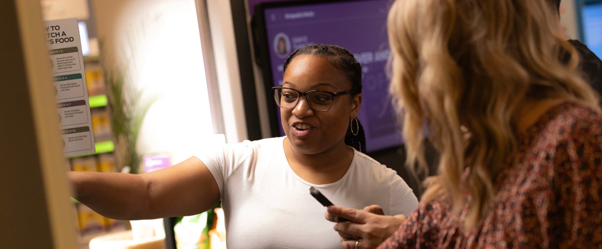 Purina associates looking at pet food