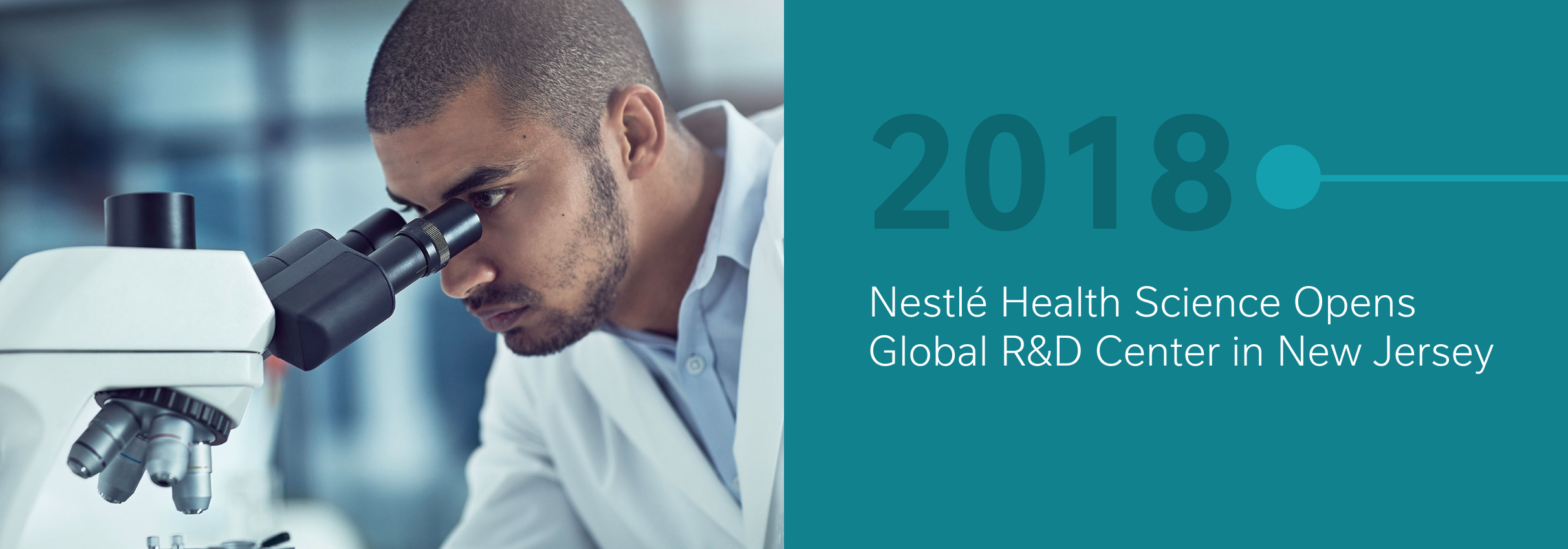 Person in lab coat looking into a microscope, with 2018 and text about a New Jersey R&amp;D center.