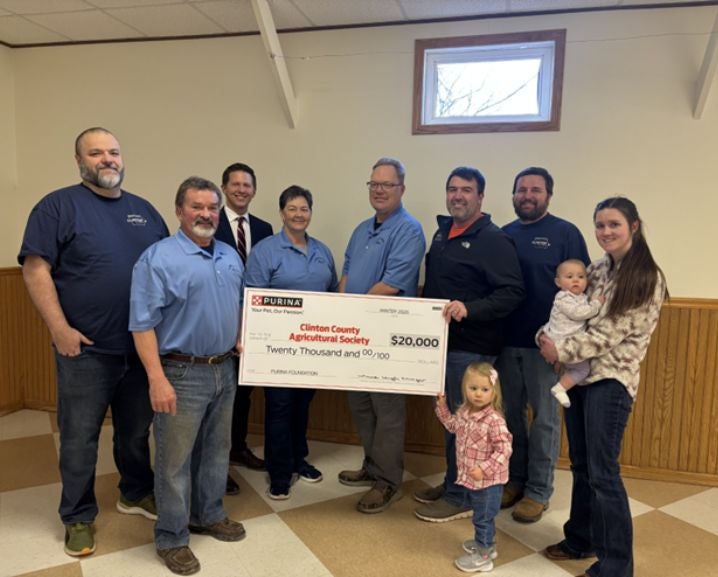 People holding $20,000 check