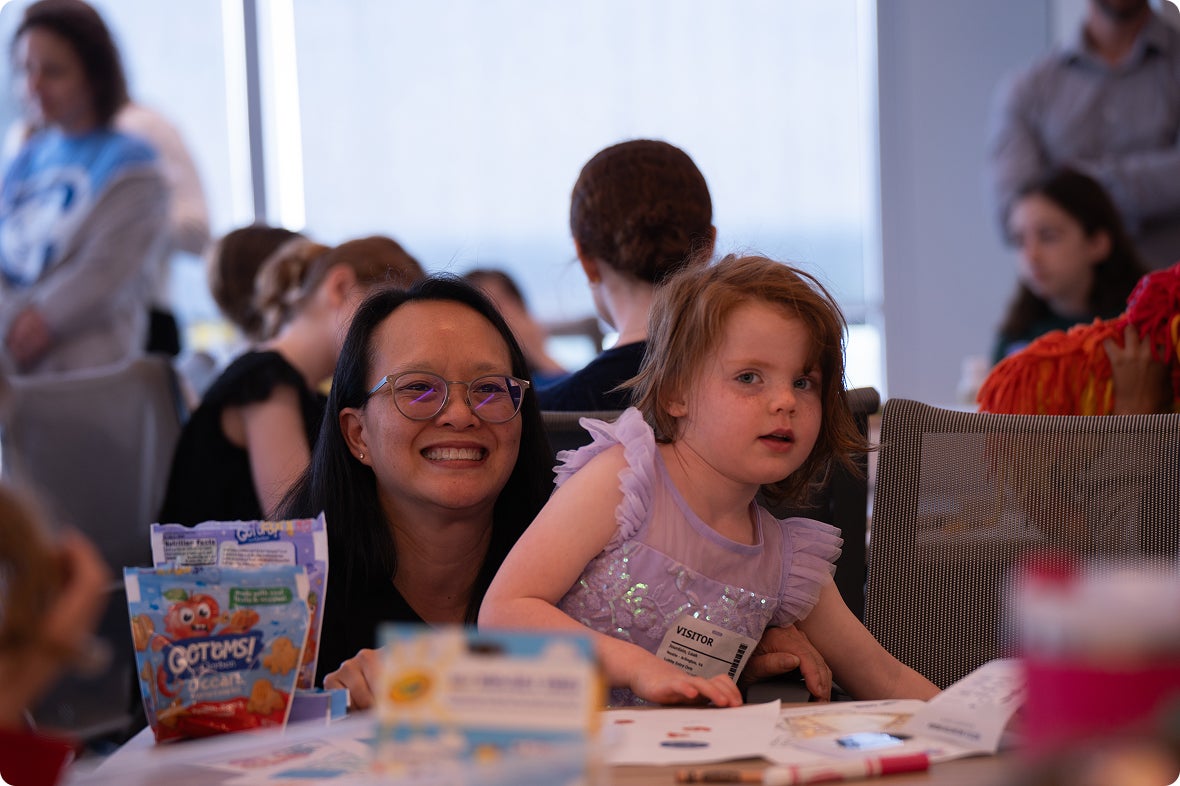 Woman smiling with her daughter