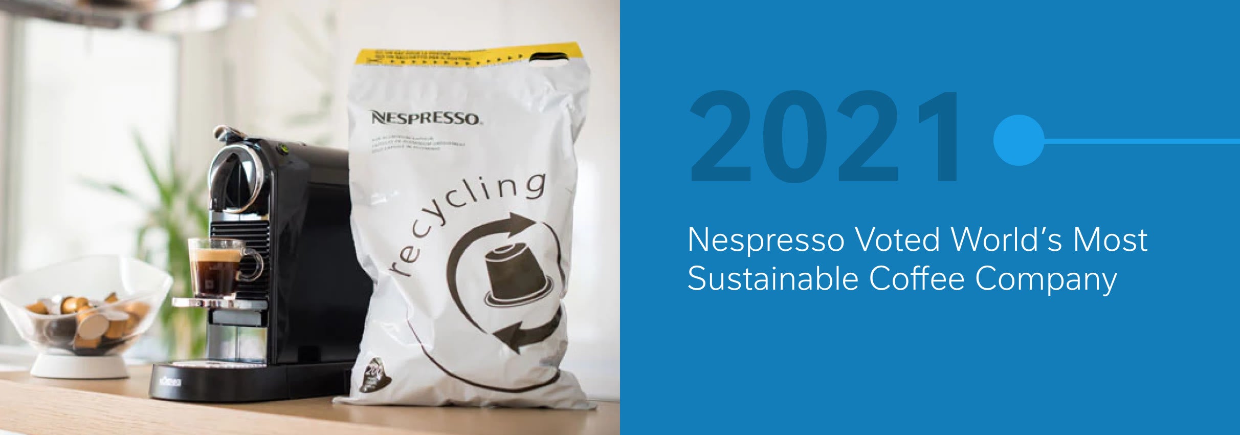 Nespresso machine and recycling bag beside a bowl of coffee pods; 2021 sustainability award mentioned.