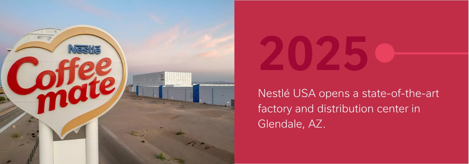 Coffee mate sign near a new industrial building with text about a 2025 factory opening in Glendale, AZ.