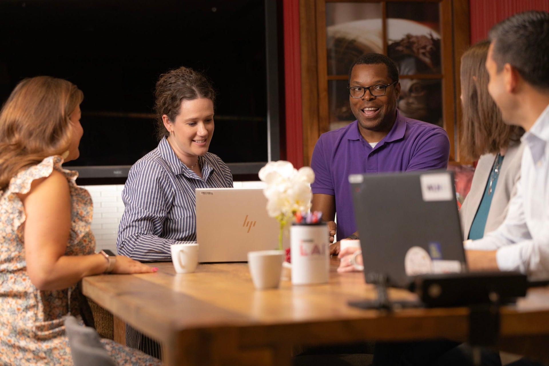 Associates in a meeting around a table