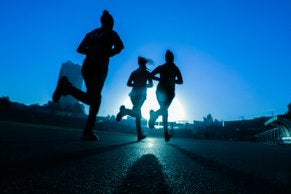 People running on pavement 