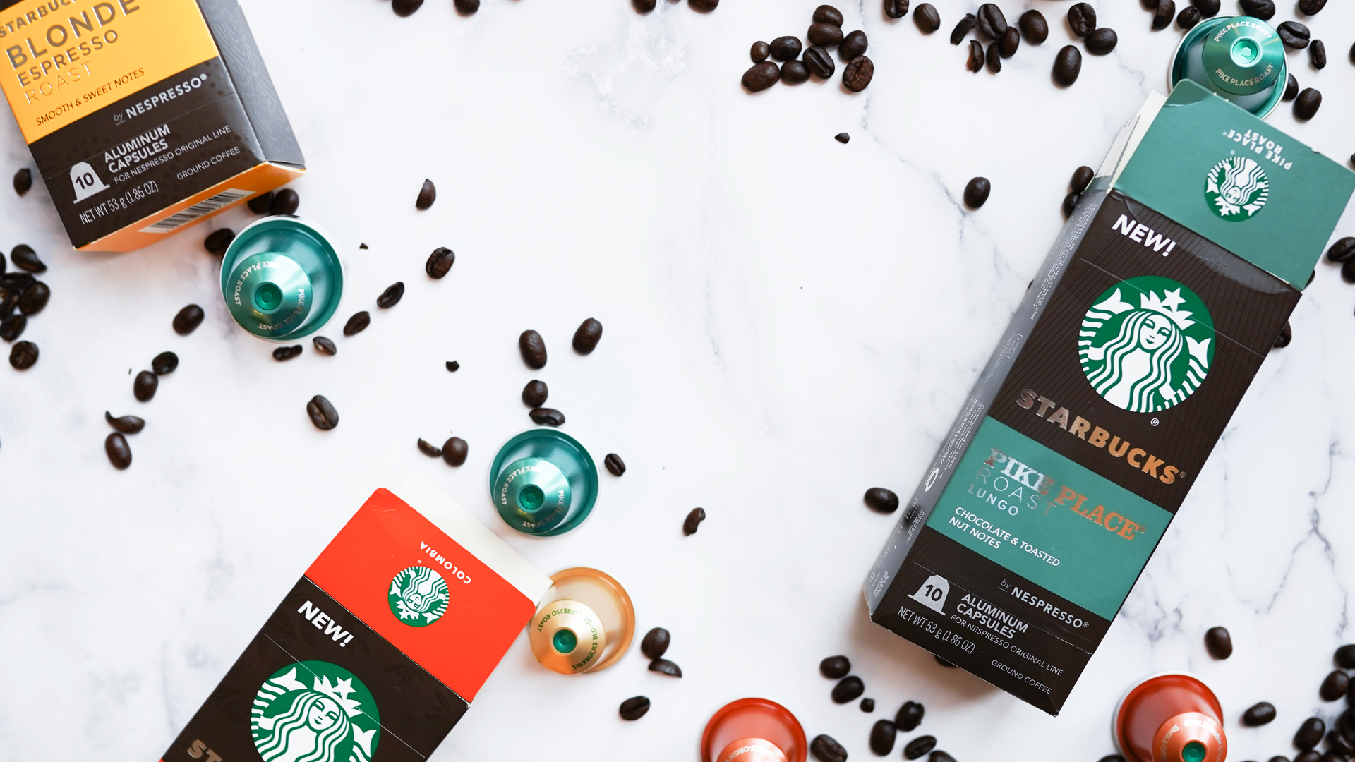 Starbucks packaging, coffee pods, and coffee beans 