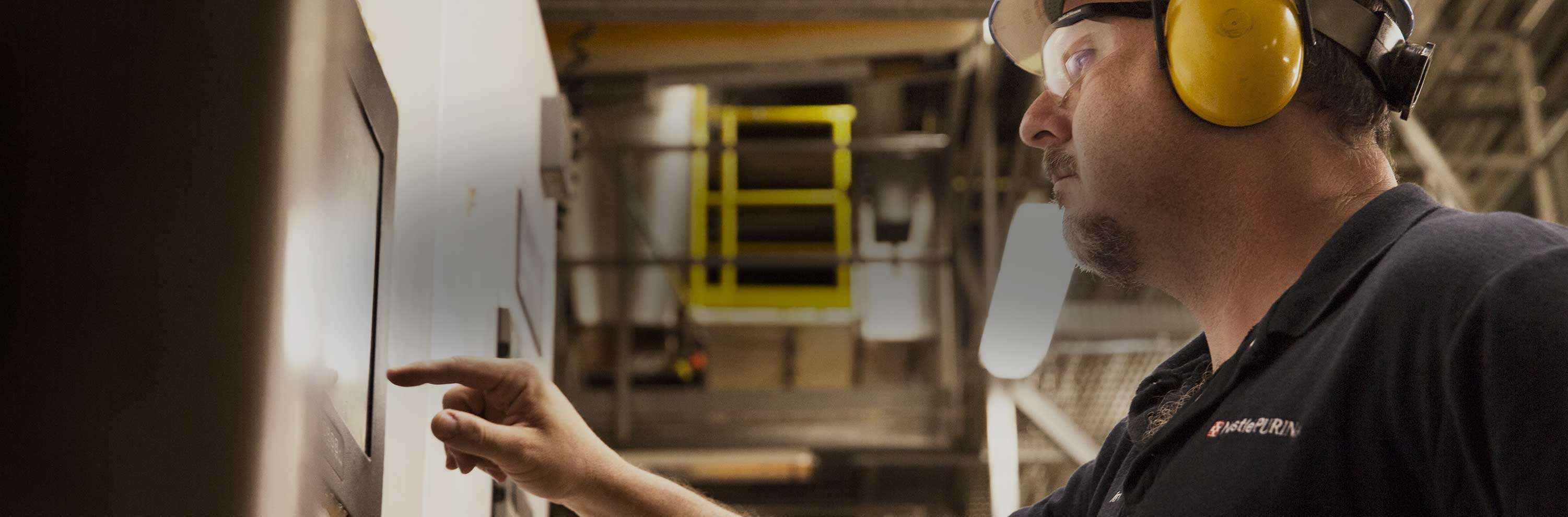 Nestlé Purina associate working in a factory