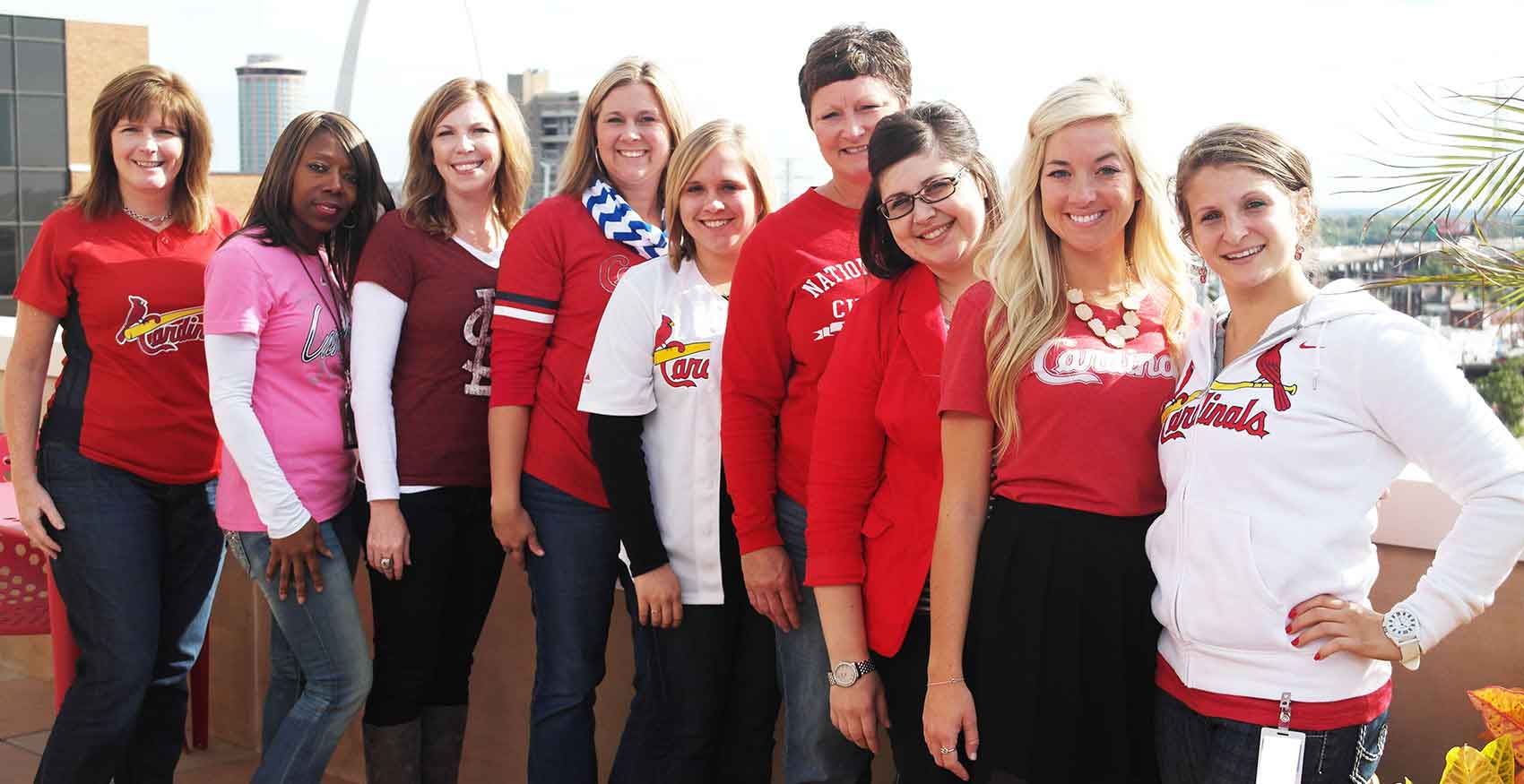 Purina associates posing at a Cardinals game
