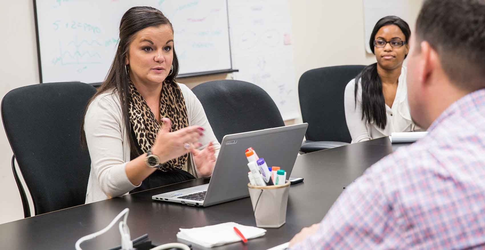 Female associate speaking in a meeting