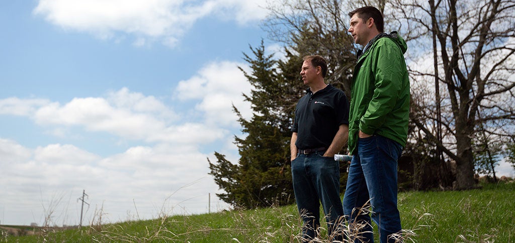 Two males standing outside