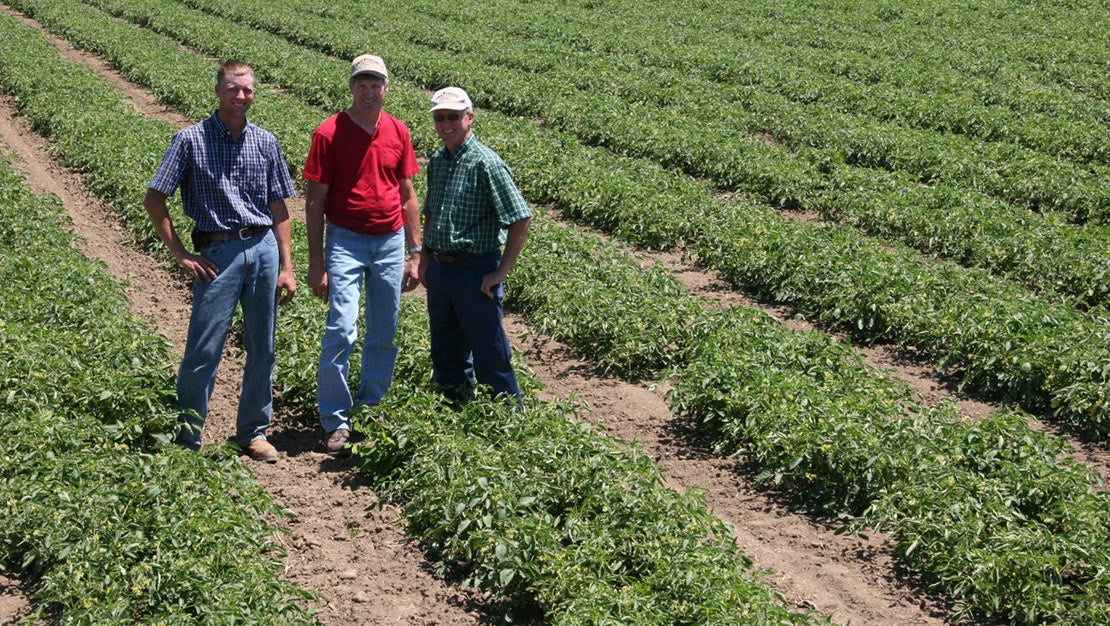 Farmers smiling at camera