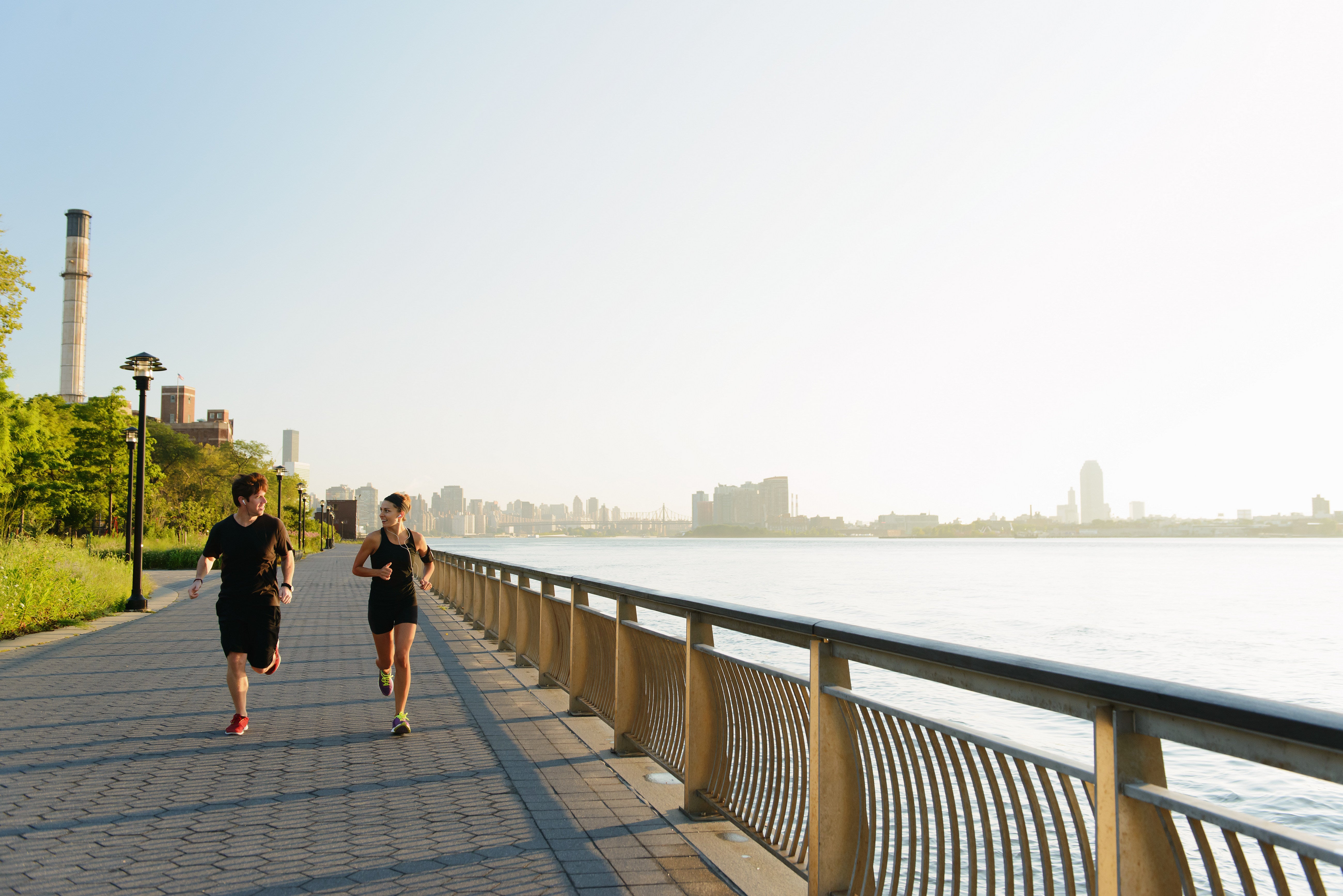 Couple running on bridge 