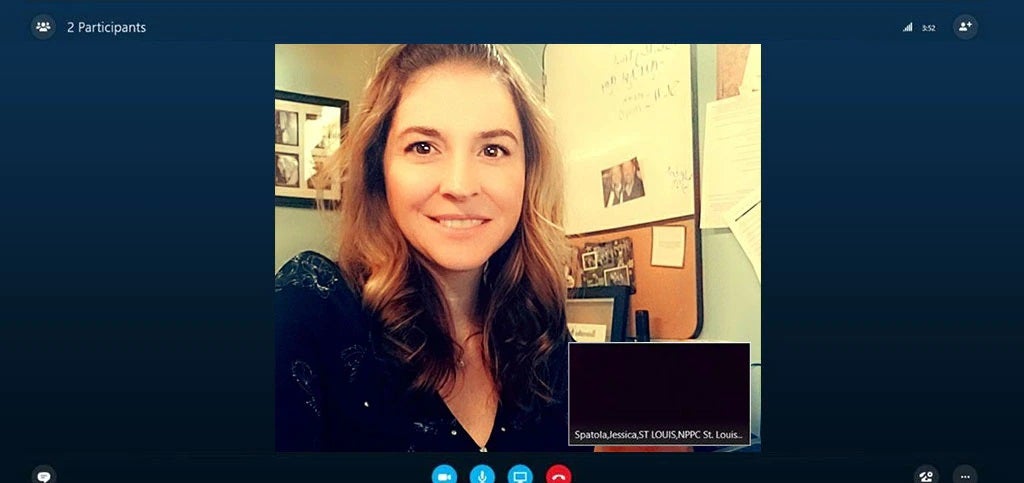 Woman smiling in virtual meeting