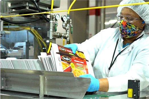 Nestle factory worker working on the Stouffer's line