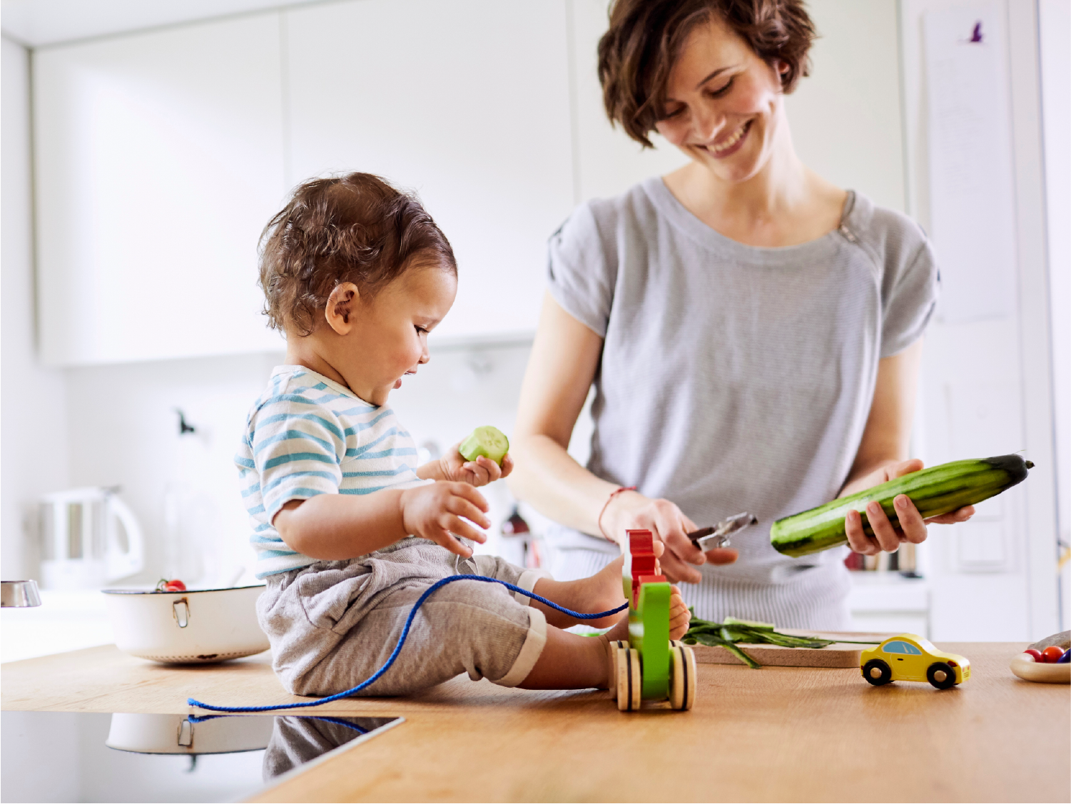 Baby and mom cooking together
