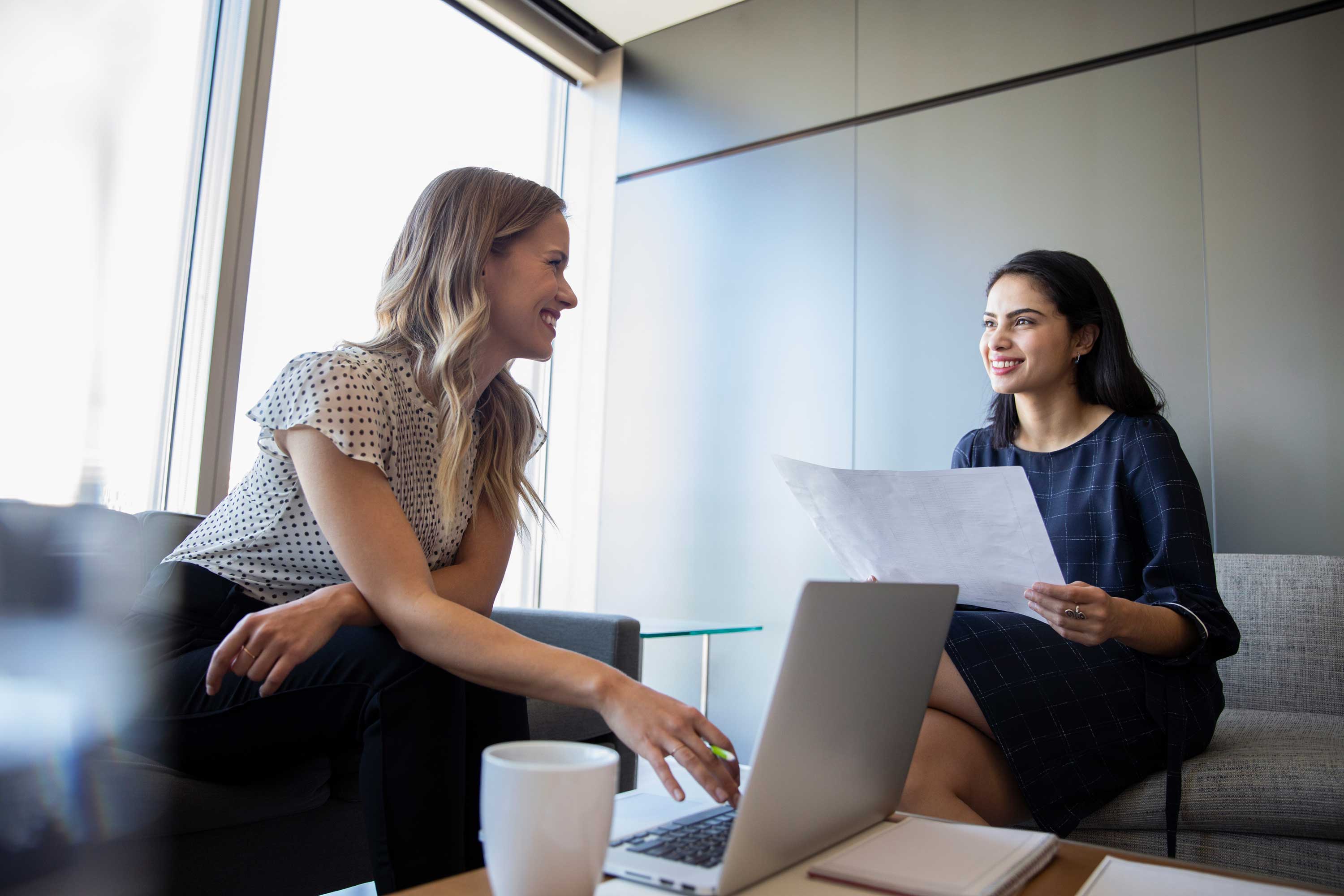 Employees talking with one another