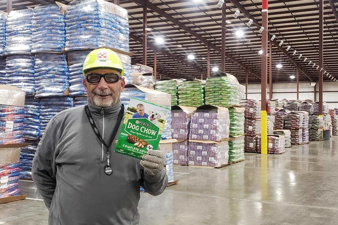 Nestlé Purina associate posing with Dog Chow