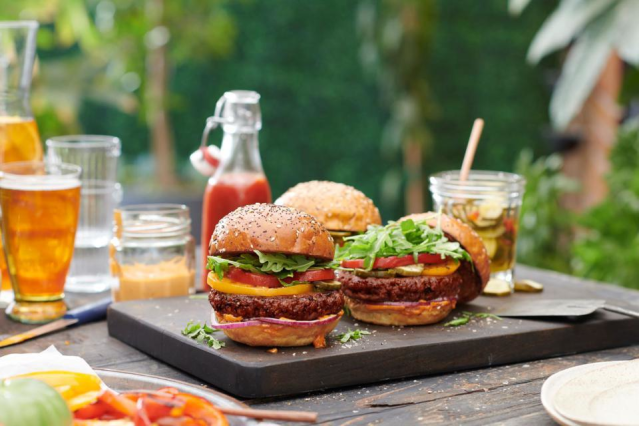 Cheeseburgers on an outside party table