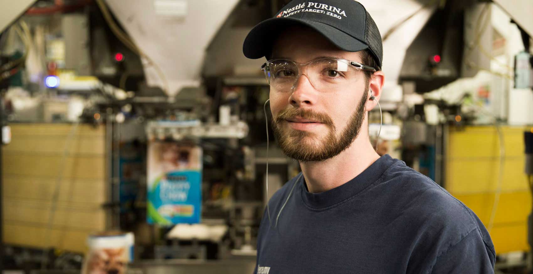 Man smiling with safety glasses on