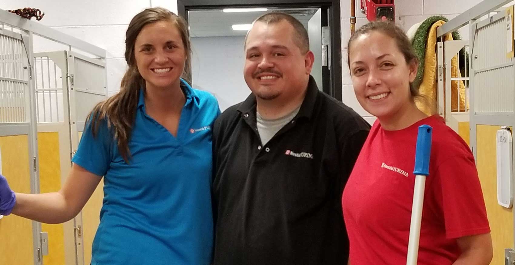Associates smiling and standing together