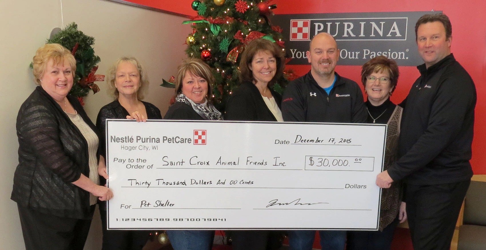 Group of people holding donation check