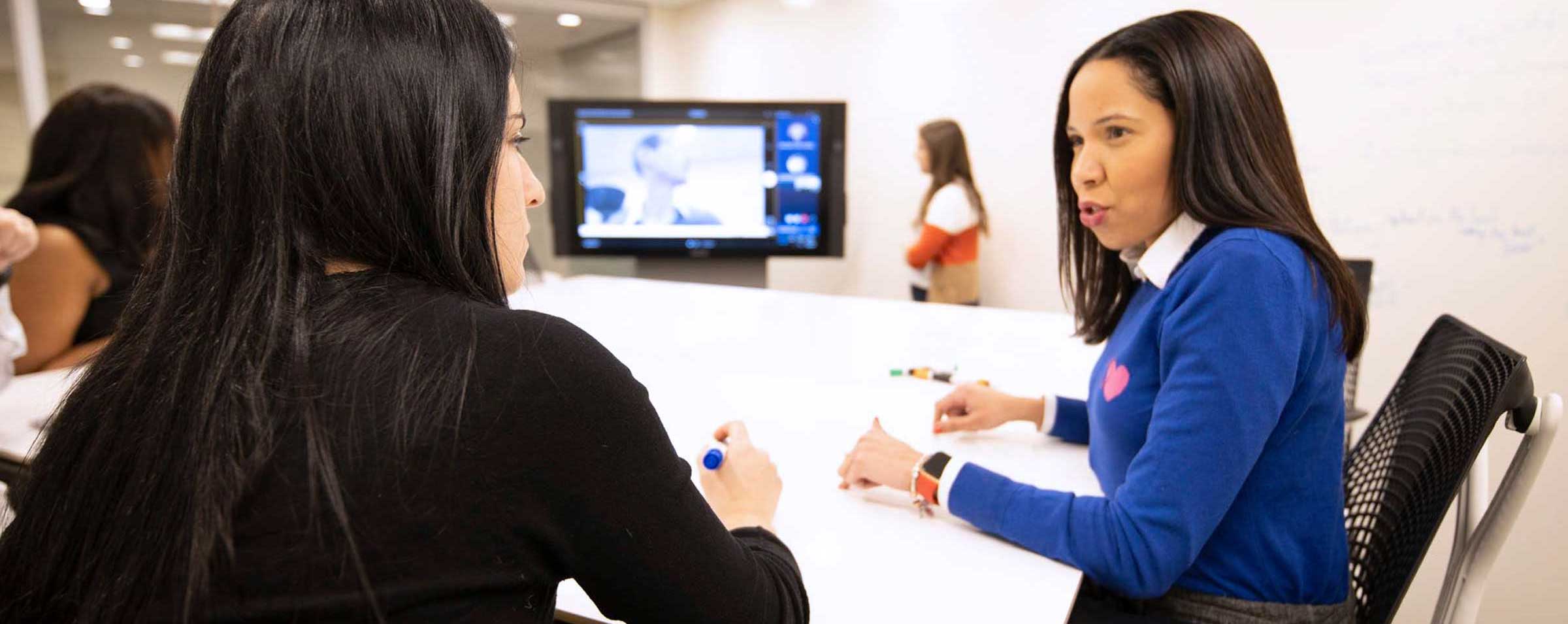 Women discussing at a meeting