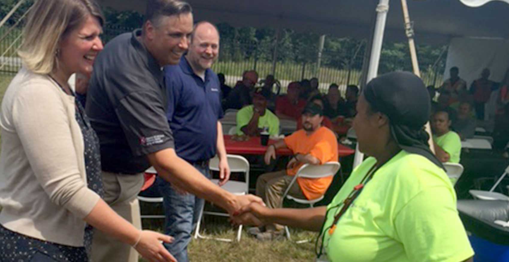 Shaking hands at a volunteer event