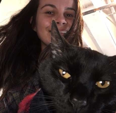 Woman smiling with cat