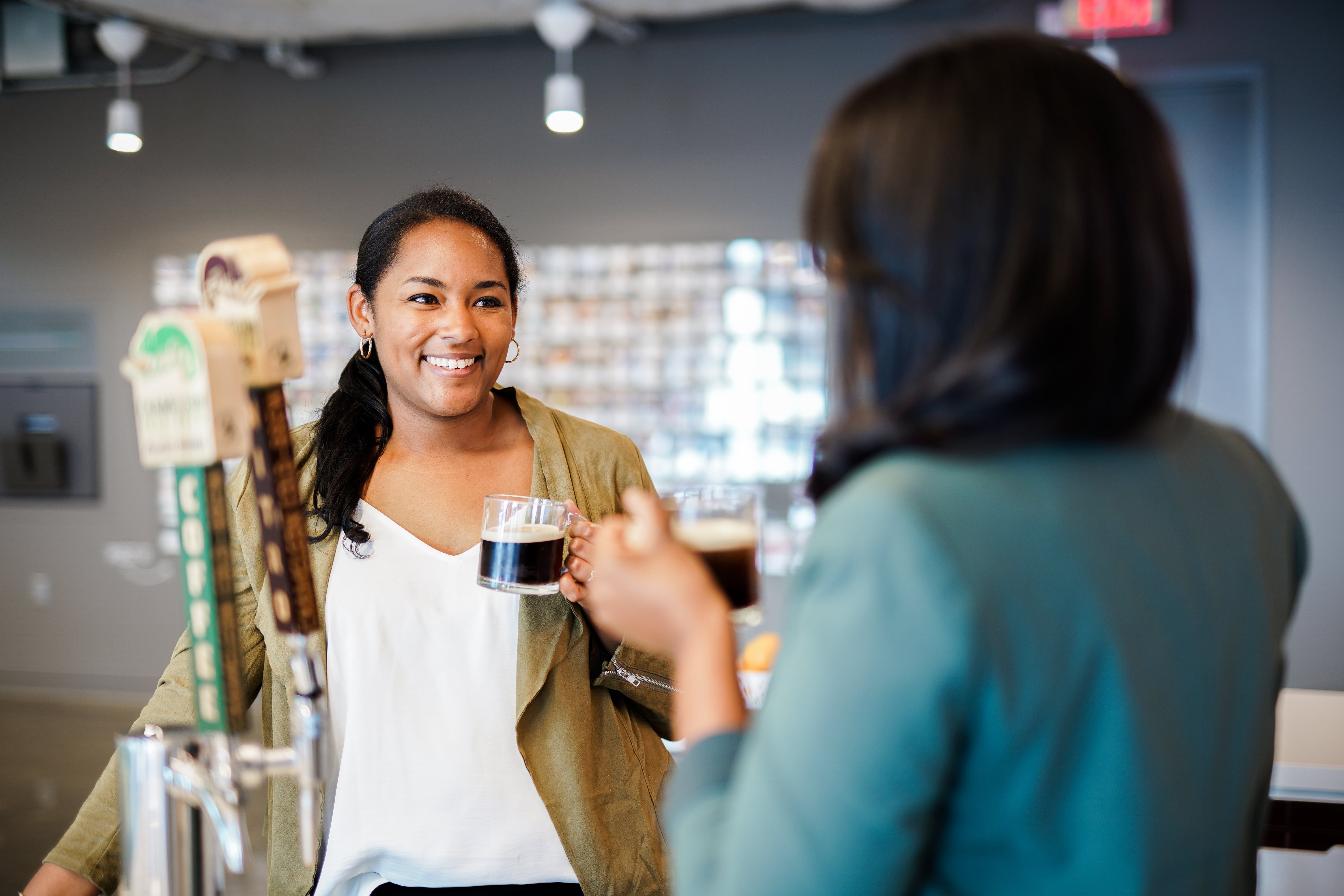 two nestle employees drinking coffee