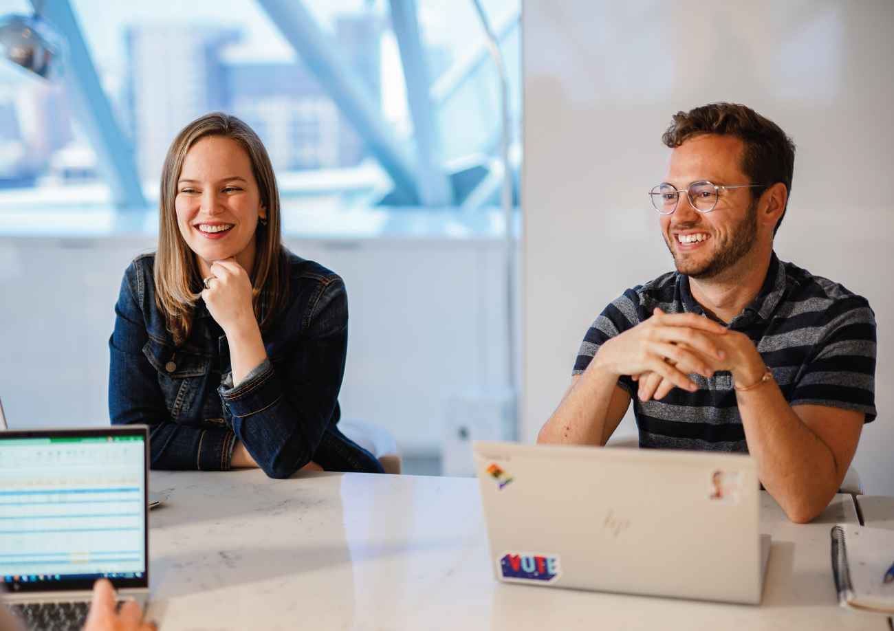 Interns collaborating at table