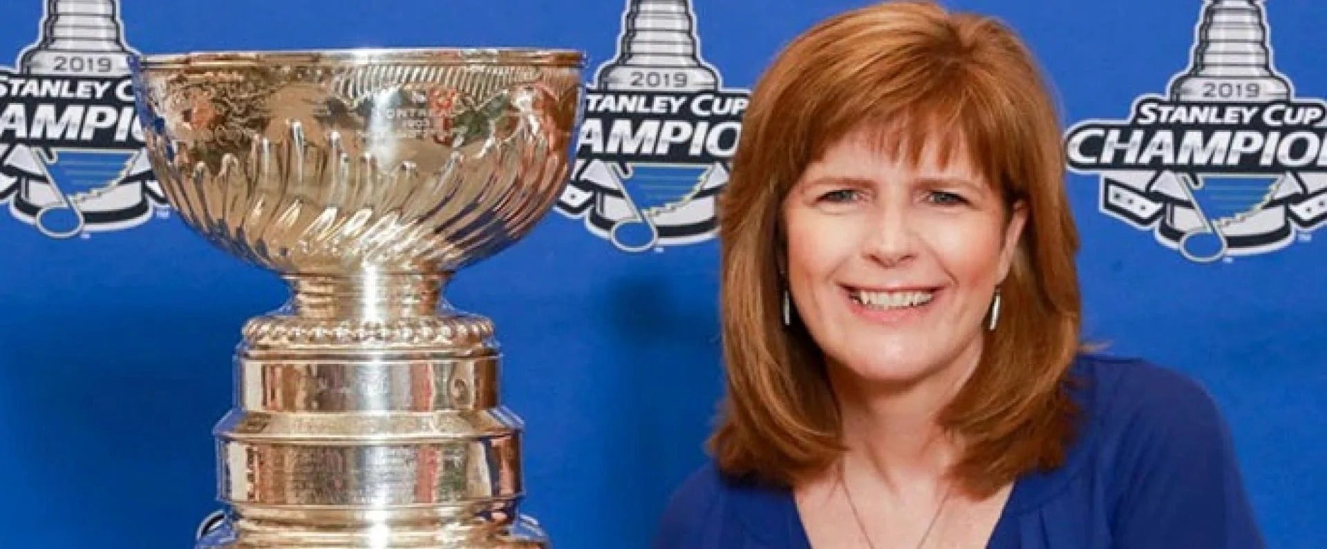 Employee posing with Stanley Cup