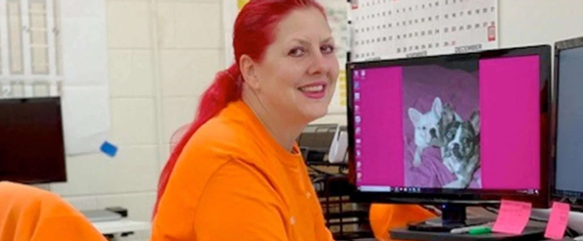 Female employee sitting at desk working