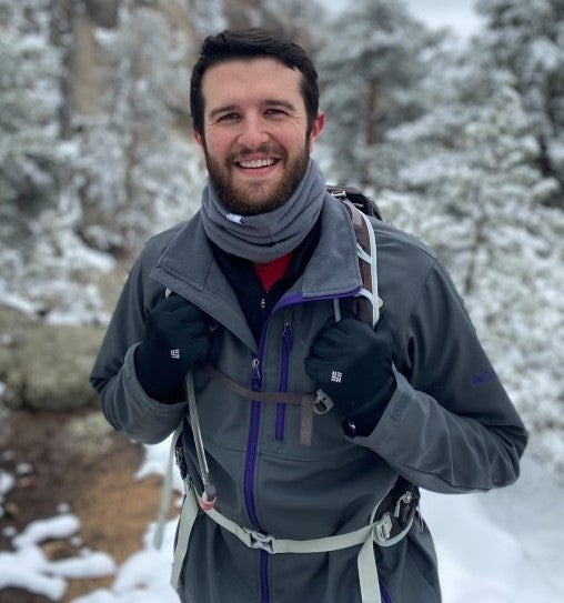 Man standing snow smiling