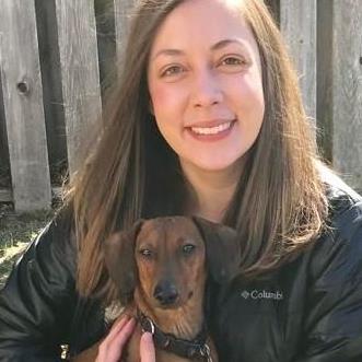 Woman holding a small dog