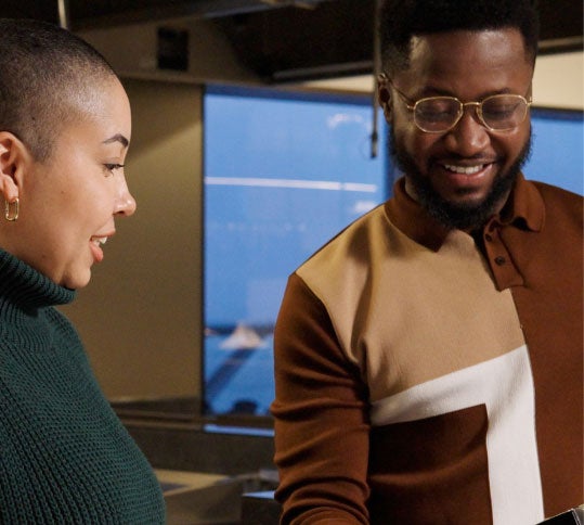 Two employees working in the office together