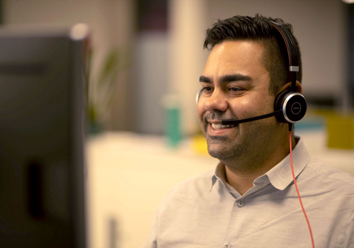 Employee on headset talking to candidate