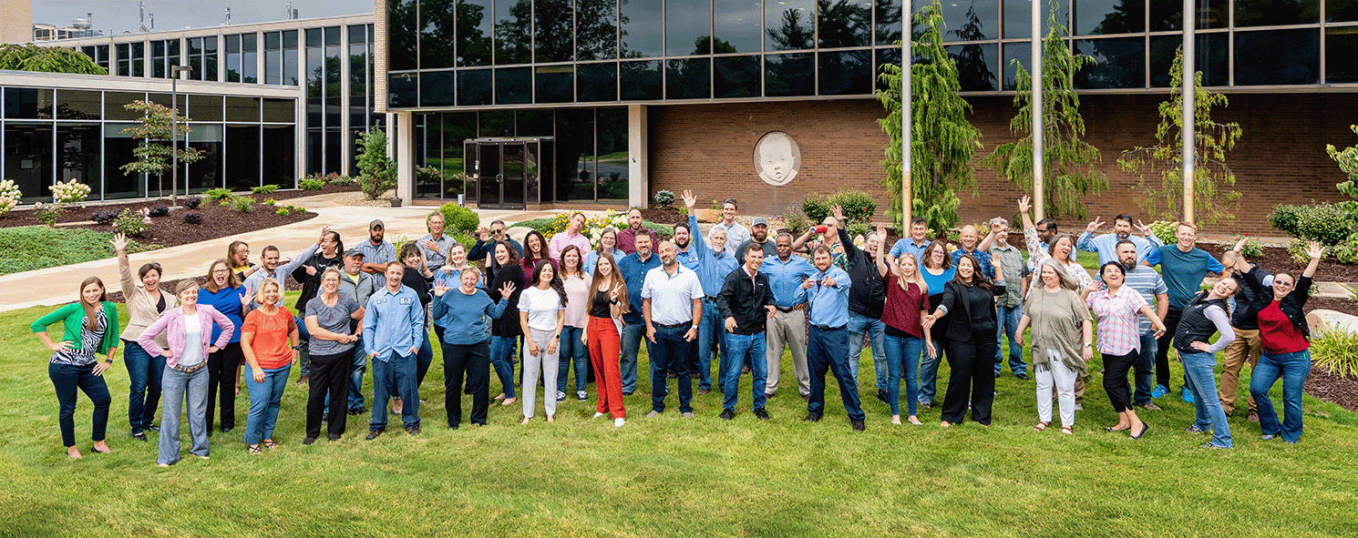 Fremont Team Photo in front of building