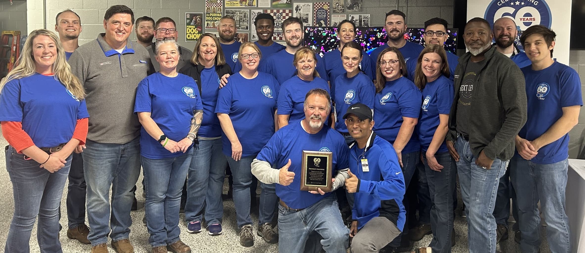 cat chow team posing with an award