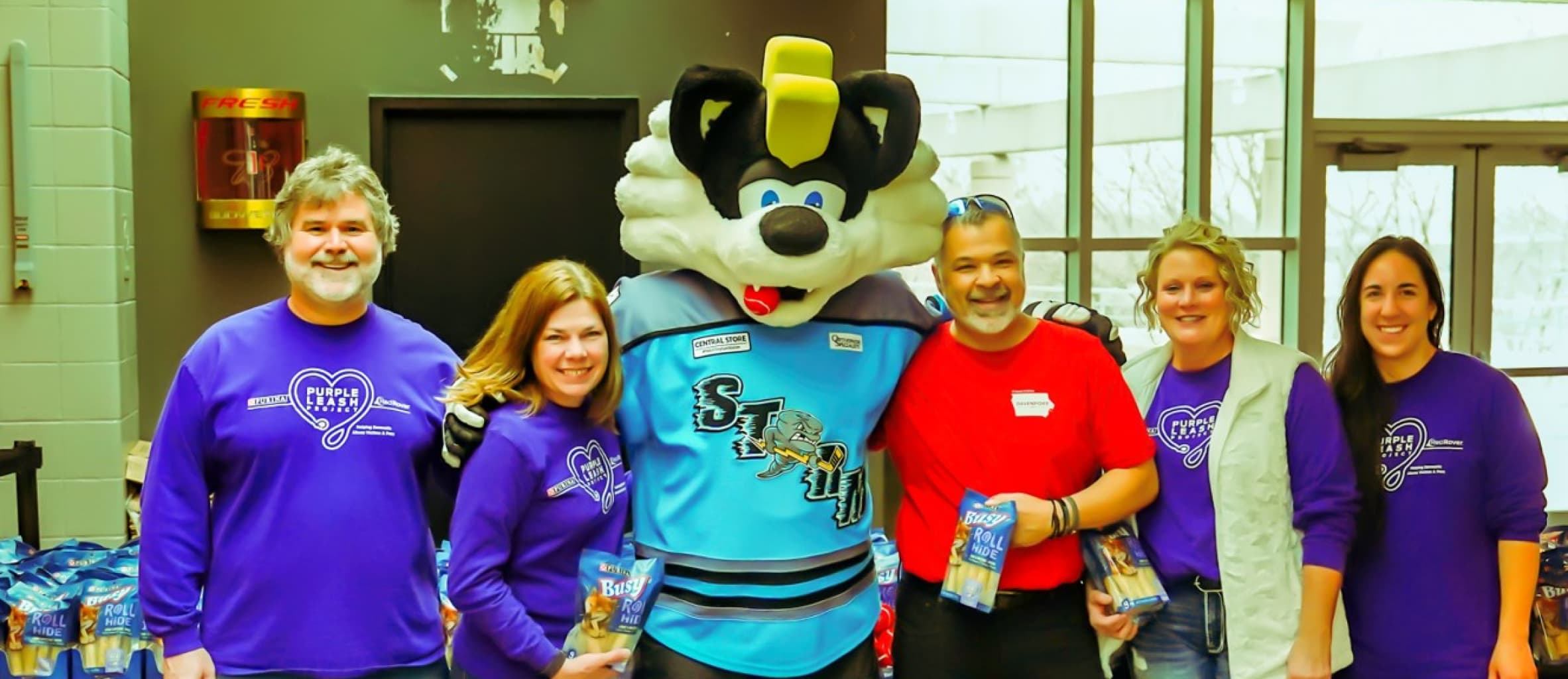 Purple Leash team with Storm mascot