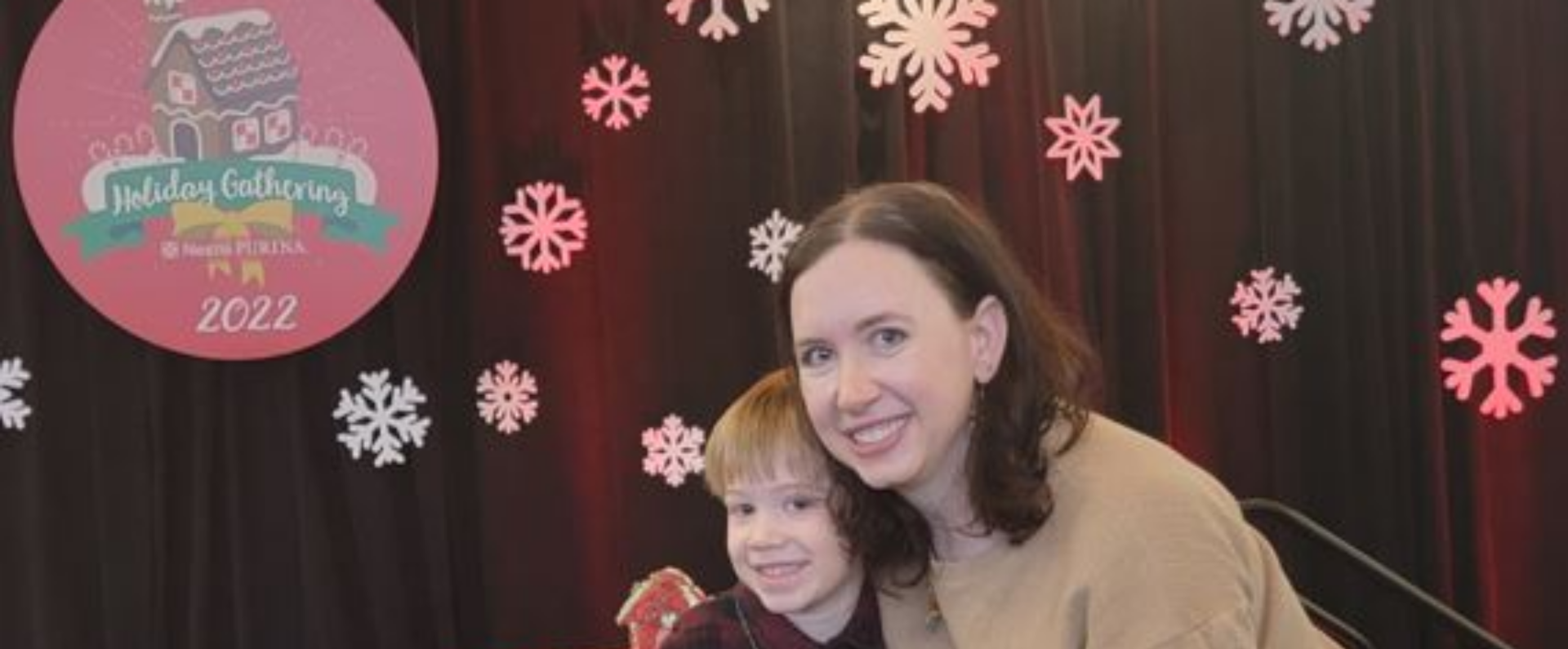 Woman and her son smiling at Nestlé Purina office