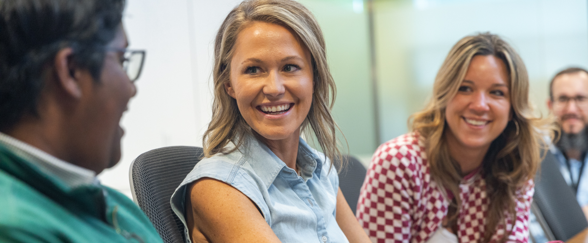 Purina employees smiling during meeting