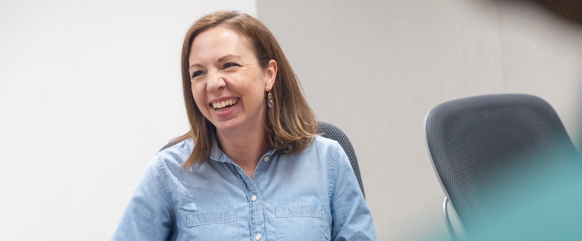 Woman smiling at table