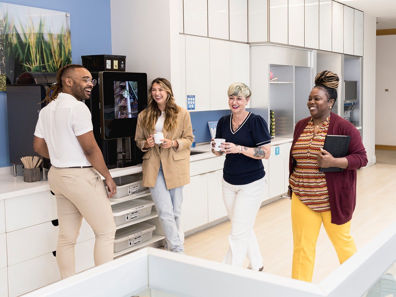Nestle employees laughing in the break room