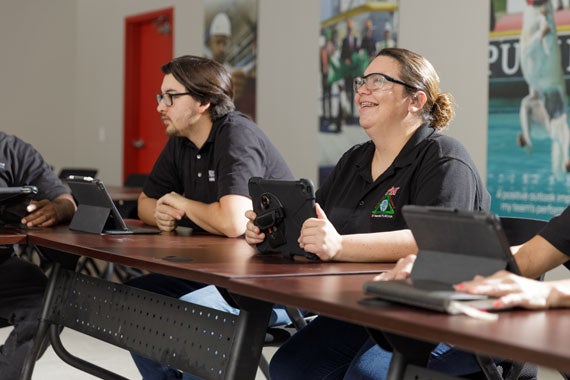 Nestle Purina employees sitting in training session