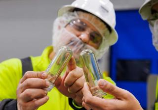 Nestle Glendale workers inspecting test tubes