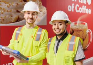 Nestle Glendale employees reviewing plans on iPad