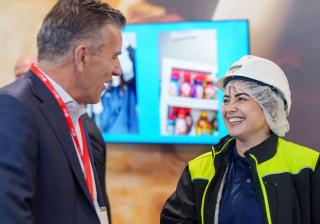 Nestle executive talking with Glendale factory worker