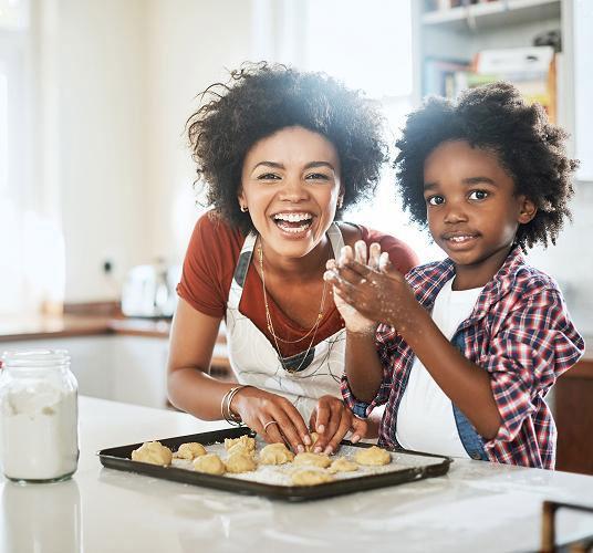 Mother and son making cookies