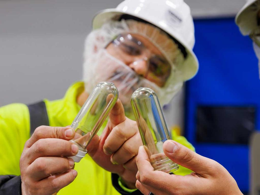 Nestle Glendale workers inspecting test tubes