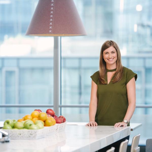 Woman smiling in office kitchen